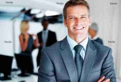 Male executive with colleagues